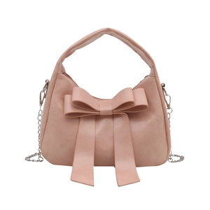 Sac à main rose en cuir PU avec grand nœud décoratif et bandoulière chaîne argent