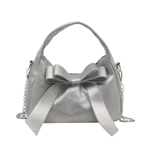 Elegant silver bow handbag with metallic finish and detachable chain strap for women