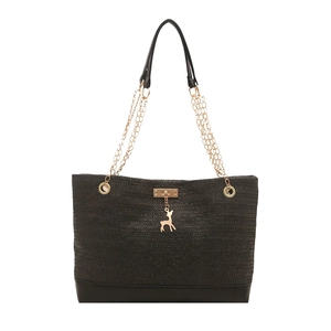 Large black woven straw tote bag with gold chain strap and deer pendant detail