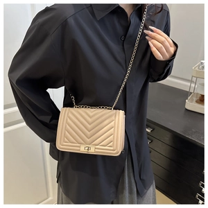 Champagne gold chevron quilted shoulder bag with elegant metal chain strap and twist lock