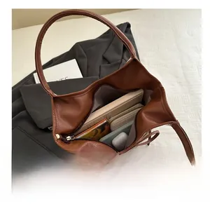 Top view showing the spacious interior of the brown lychee grain tote with daily essentials