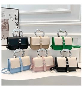 Detailed view of multiple color options for the tote bag with decorative belt straps