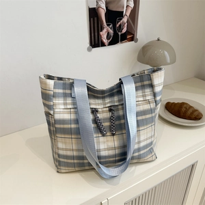 Chic blue and white plaid tote bag with wide shoulder straps for casual daily use