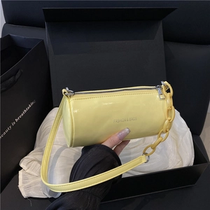 Borsa a tracolla cilindrica giallo brillante alla moda con catena e cinturino
