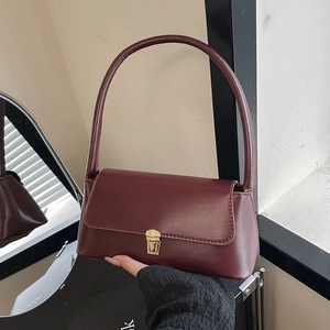 Elegant wine red leather baguette underarm bag with gold metal clasp for women