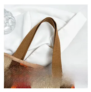 Detail of colorful striped woven cotton tote with reinforced wide handle stitching