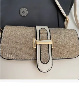 Detail of a chic square bag featuring a gold glitter woven flap and metallic buckle