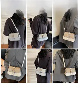 Detail view of stylish square crossbody bags with metallic H buckle and glitter stitching