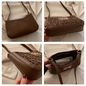 Detailed views of leopard print underarm bag with gold bow and smooth zip interior