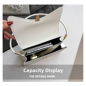 Interior view showing large capacity storage of white cat-ear shaped flap handbag