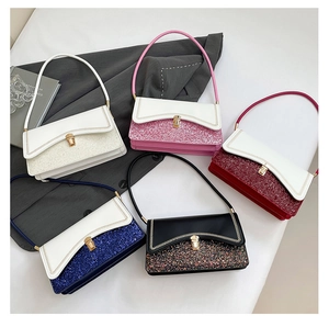 Detail of five sequin patchwork shoulder bags in various colors with metal locks
