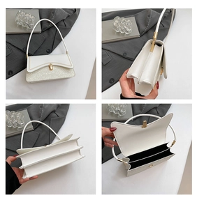 Detailed view of the white sequined bag featuring double compartments and a gold metal lock