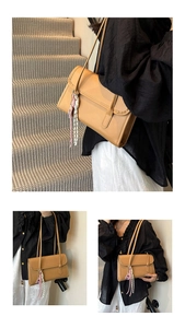 Detail of light brown rectangle shoulder bag featuring a woven rope ornament and top flap
