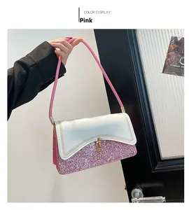 Close-up of pink sequin patchwork shoulder bag with V-shaped stitching and gold clasp