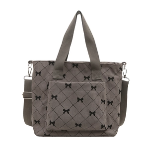 Borsa tote minimalista in velluto a coste grigio con motivo a fiocchi neri