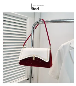 Detail of red sequin and white leather underarm bag with gold buckle and weave stitch