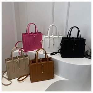 Collection of minimalist square handbags in pink, white, black, beige, and brown colors