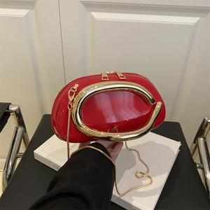 Retro red patent leather box bag with large gold C-shaped handle and snake chain