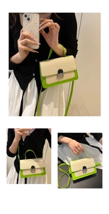 Detailed view of beige woven fabric patchwork crossbody bag with neon green leather trim