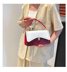 Detail of red and white contrast handbag with gold woven chain stitching and square buckle