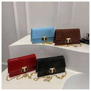 Stone embossed leather chain crossbody bag with golden T-lock in four elegant colors