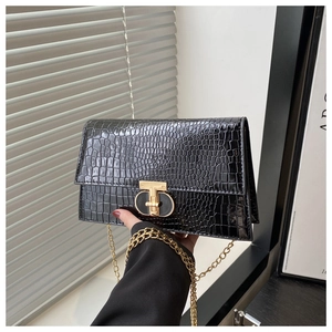 Black crocodile-pattern chain bag with gold T-shaped clasp and metallic strap