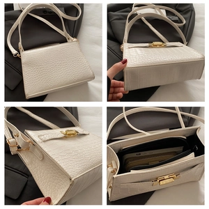 Detailed views of white crocodile pattern shoulder bag with golden clasp and spacious interior