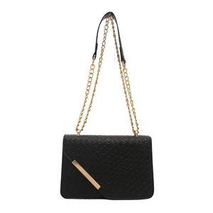 Chic black woven texture crossbody bag with gold chain strap and metal trim on white background