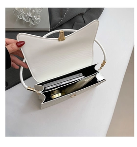 Detailed top view of the white bag interior with two compartments for makeup and phone