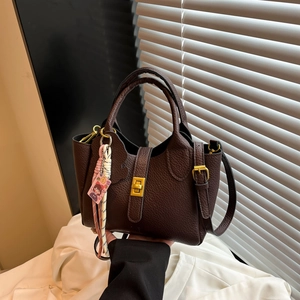 Elegant dark brown lychee texture bucket handbag with gold-tone lock and strap
