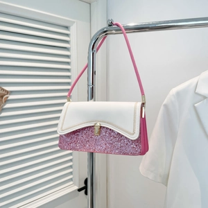 Pink and white shoulder bag with sequins, wave stitching, and gold buckle on a stand
