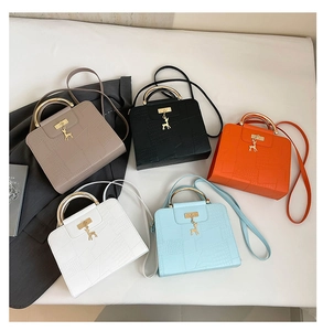 Detailed collection of crocodile embossed satchel bags with golden deer charms in five colors