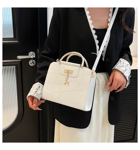 White crocodile pattern handbag with gold elk pendant and metal ring handle details