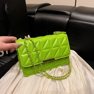 Neon green quilted crossbody bag with gold chain strap and metallic lock closure
