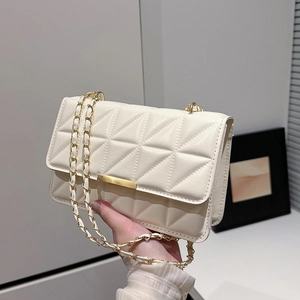 Minimalist beige quilted crossbody bag with gold chain strap for casual daily wear