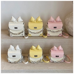 Mini crossbody bags with oversized bows, woven texture, and metallic chain in three colors