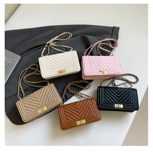 Close-up of quilted crossbody bags in five colors with chain straps and metal buckles