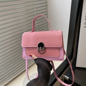 Pink minimalist crossbody bag with textured flap and silver metal clasp for women
