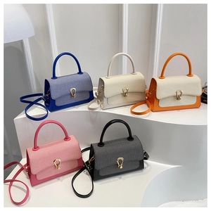 Five elegant leather and fabric crossbody bags displayed in blue, beige, orange, pink and black