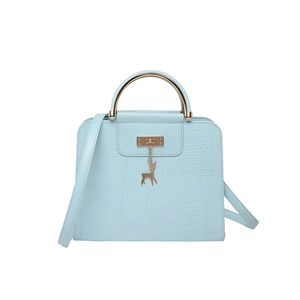 Light blue faux crocodile handbag with gold round handles and a deer pendant charm
