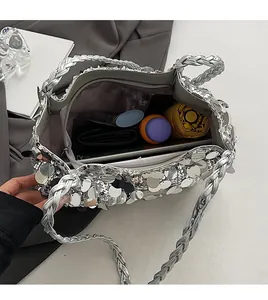 Spacious silver sequin tote bag interior showing large capacity for umbrella and tablet