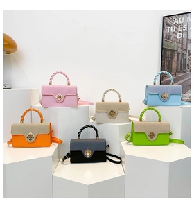 Modern mini crossbody bags displayed in six colors on tiered stands with woven handles