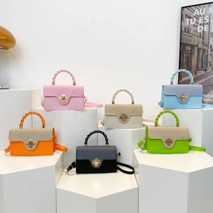 Chic color-block crossbody bags with woven handles and flower-shaped metal buckles