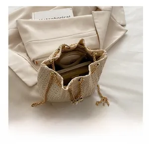 Detail shot of the beige straw bucket bag interior showing spacious storage capacity