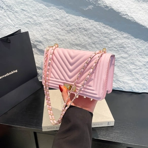 Pink chevron quilted shoulder bag with gold chain strap and square metal lock