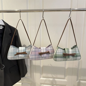 Three Korean-style plaid baguette bags in blue, pink, and green with chic leather bows