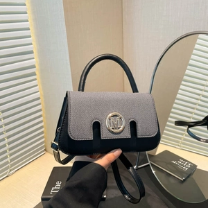 Fashionable grey and black mini handbag with gold M logo and adjustable shoulder strap