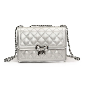 Silver quilted crossbody bag with heart bow clasp and metal chain strap for women