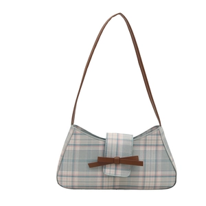 Chic plaid baguette underarm bag with brown leather bow and strap on white background