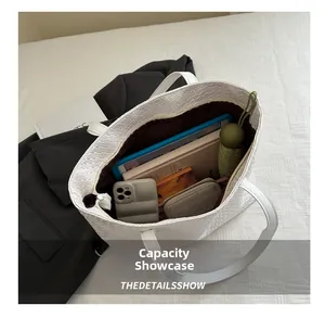 Spacious white woven tote bag interior showing capacity for tablet, phone and daily essentials